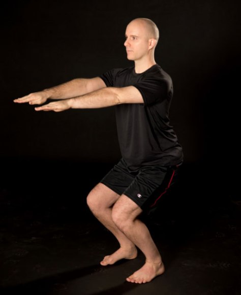 brian-paquette-chair-pose-chagrin-yoga.jpg